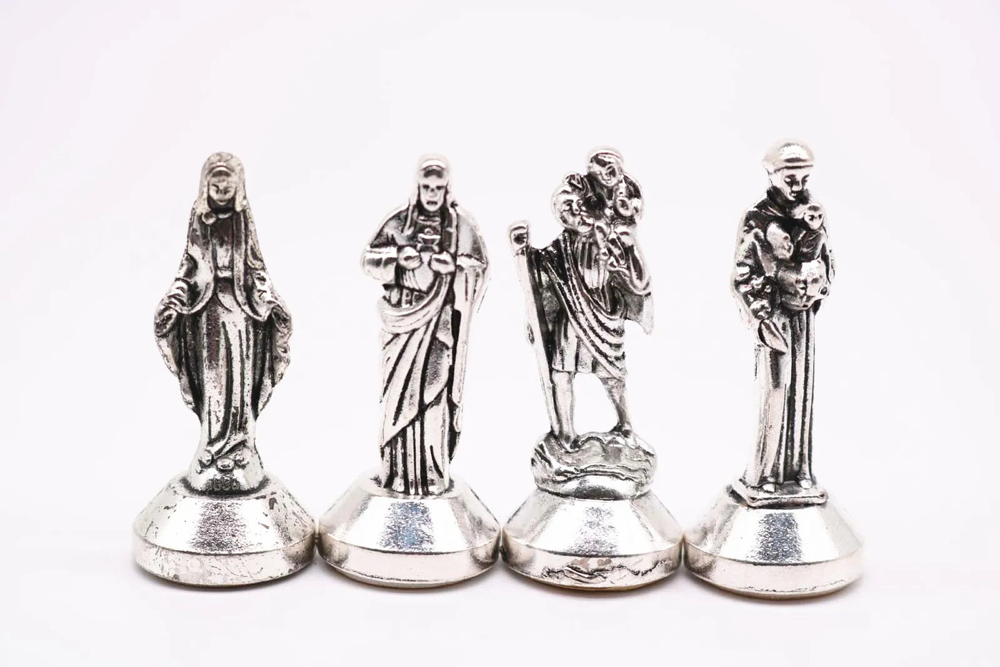 Many styles of Christian decorations. Jesus, Madonna Maria, Rose, Lady Fatima, Figurine. Car dashboard decoration.